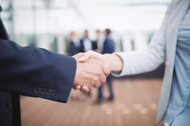 Close-up of businesspeople shaking hands Close-up of businesspeople shaking hands